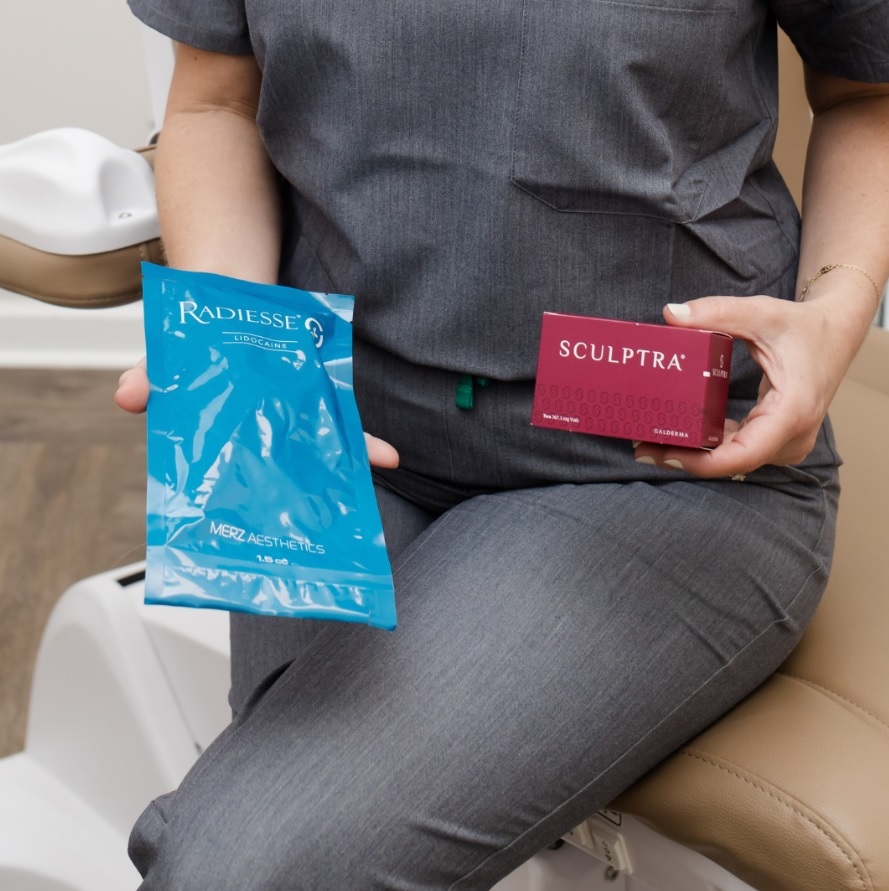 Person holding Radiesse and Sculptra treatments for facial rejuvenation.