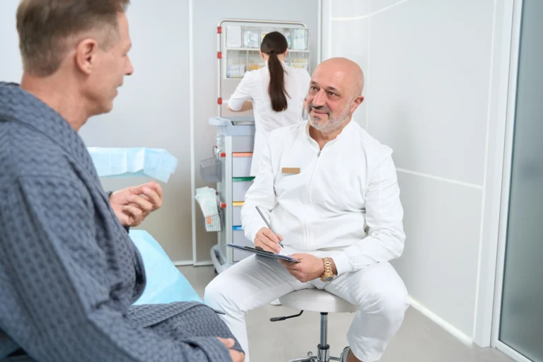 Doctor speaking with male patient during hormone health consultation