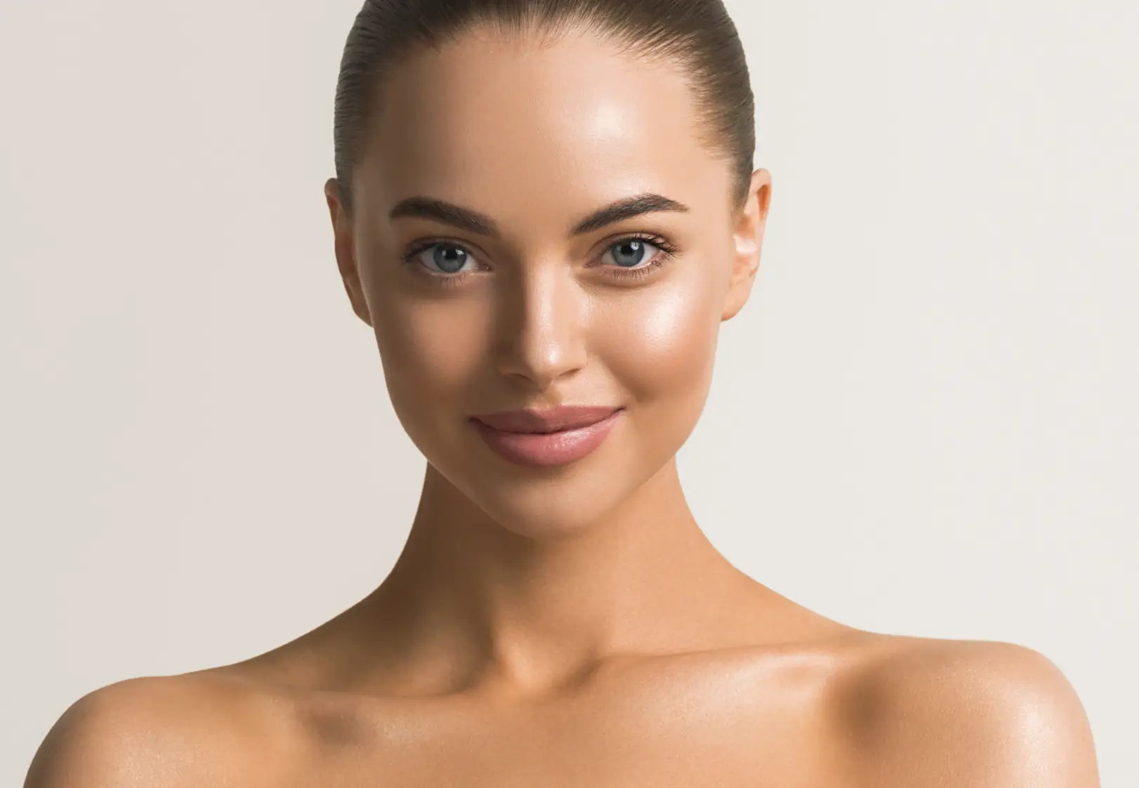 Close-up portrait of a person with smooth skin looking directly at the camera.