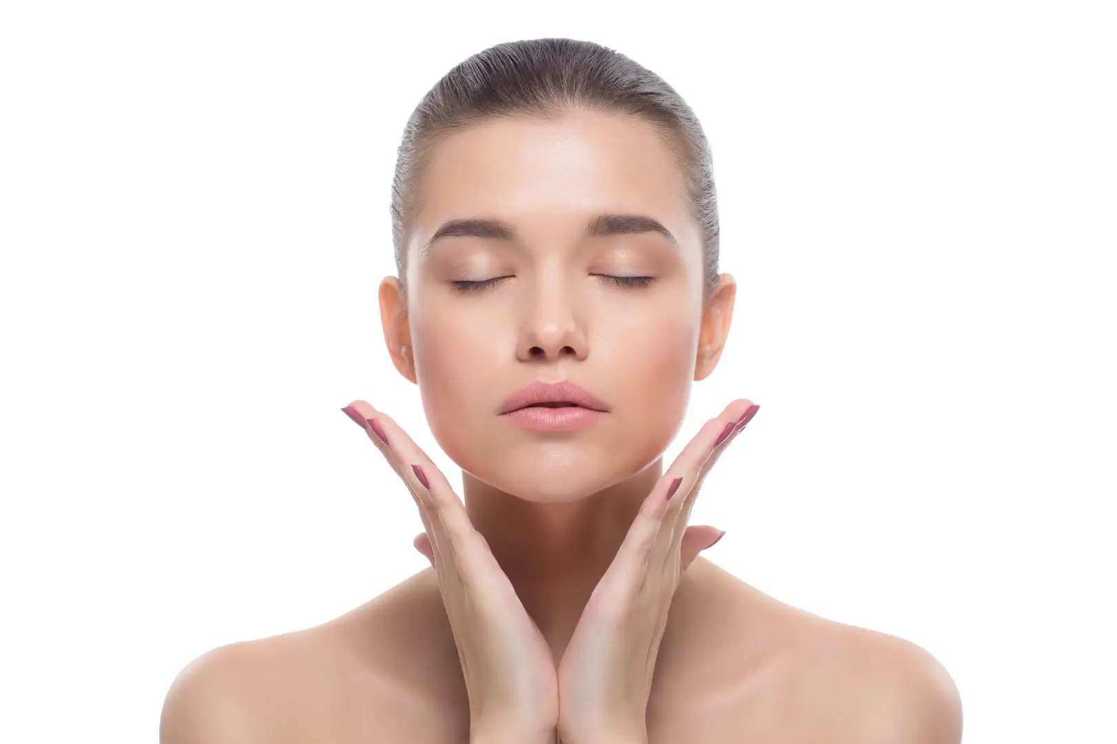 Person with eyes closed holding hands beneath the jawline.